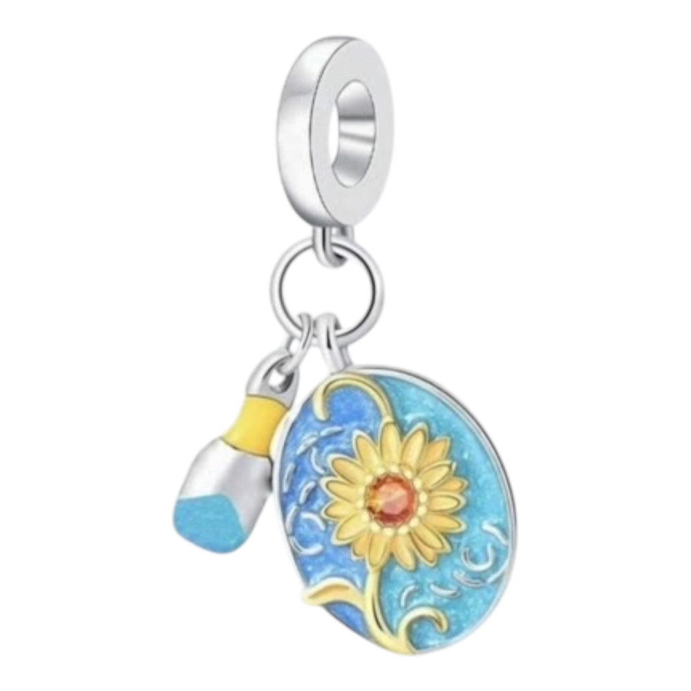 Silver charm with a sunflower design on a white background