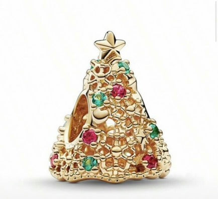 Gold Christmas tree charm with colorful gemstones on a white background