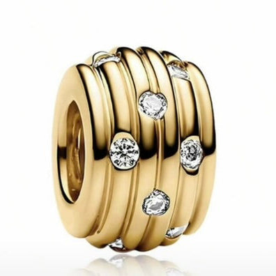 Gold charm with embedded diamonds on a white background