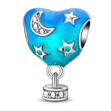 Heart-shaped charm with moon, stars, and blue gradient on a white background