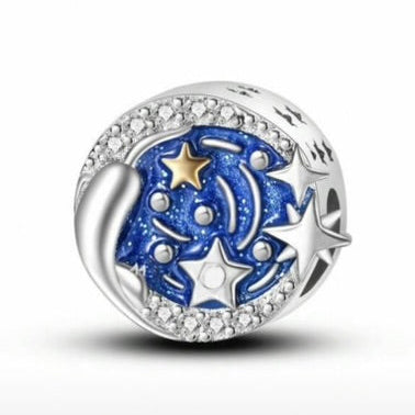Silver charm with blue and gold star design on a white background