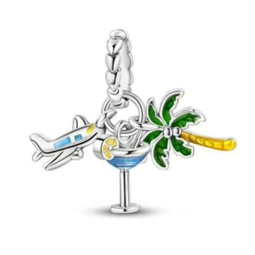 Silver charm with airplane, cocktail, and palm tree on a white background