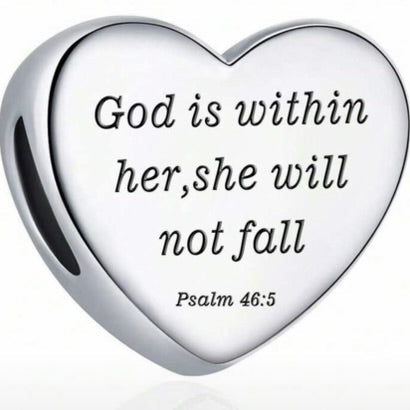 Heart-shaped silver charm with engraved text on a white background