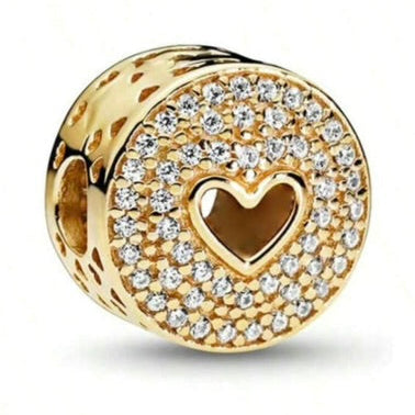 Gold charm with a heart design and clear stones on a white background
