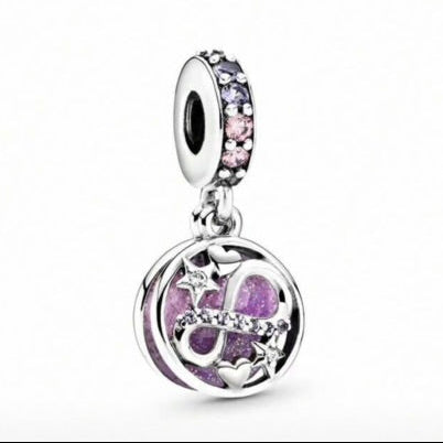 Silver charm with purple accents on a white background