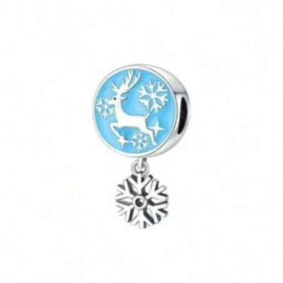 Pendant charm with deer and snowflake design on a light blue background